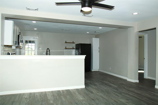 817 S Morgan St, Angleton, TX 77515 - kitchen featuring white cabinetry, freestanding refrigerator, ceiling fan, a peninsula, and dark wood finished floors