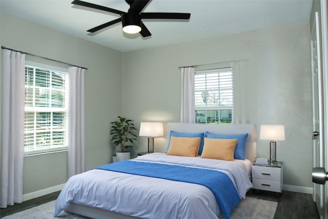 817 S Morgan St, Angleton, TX 77515 - bedroom featuring wood finished floors, multiple windows, and a ceiling fan