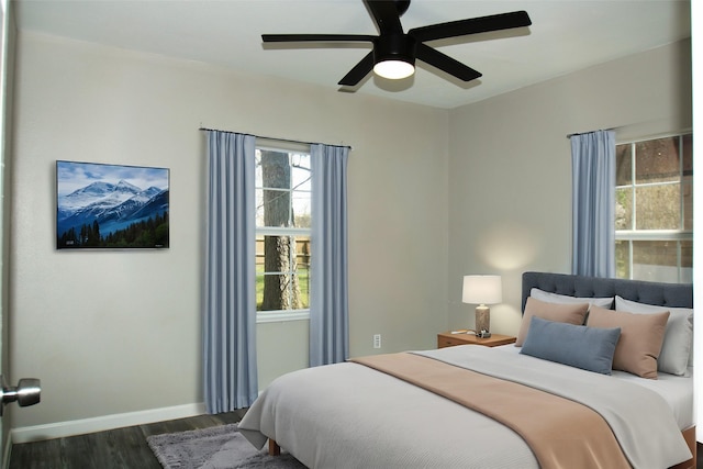 817 S Morgan St, Angleton, TX 77515 - bedroom with wood finished floors, multiple windows, and a ceiling fan