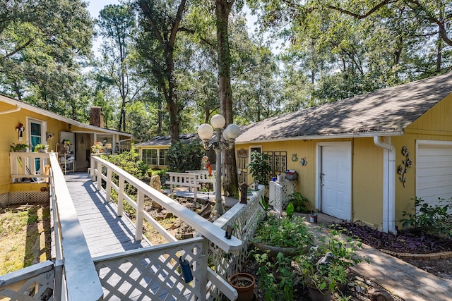 exterior space with roof with shingles