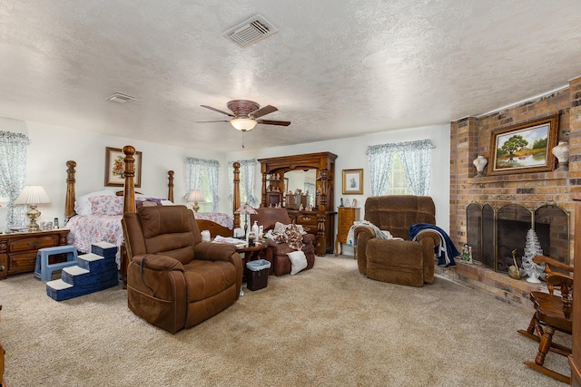 carpeted living room with a textured ceiling, a fireplace, and visible vents