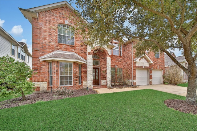 traditional-style home featuring a garage, a front lawn, concrete driveway, and brick siding