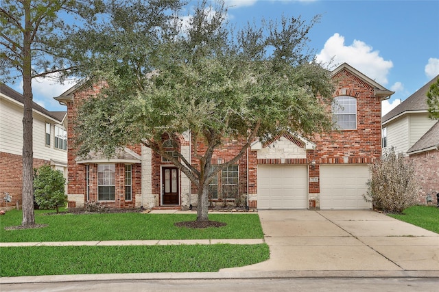 view of front of home featuring a garage, a front yard, brick siding, and driveway