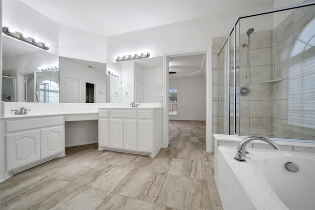 full bathroom with a garden tub, a shower stall, plenty of natural light, and vanity