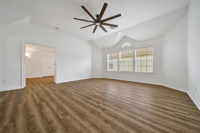 unfurnished room with lofted ceiling, ceiling fan, baseboards, and dark wood finished floors