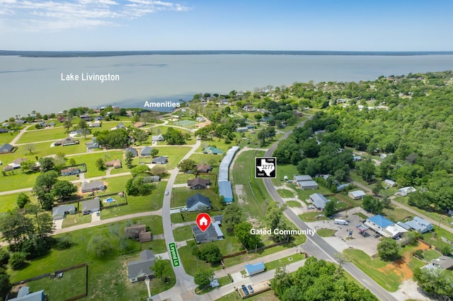 bird's eye view with a residential view and a water view