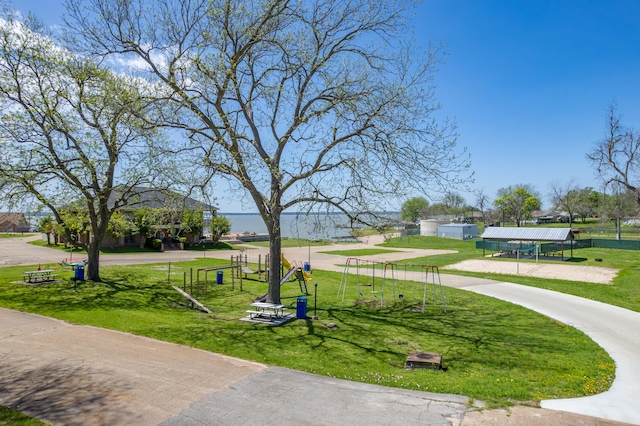 128 Legend Ln, Livingston, TX 77351 - view of home's community with a lawn and playground community