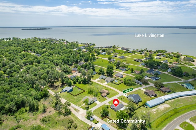 birds eye view of property with a residential view and a water view