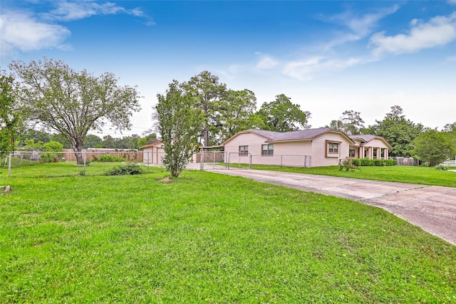 128 Legend Ln, Livingston, TX 77351 - single story home featuring fence, concrete driveway, and a front yard