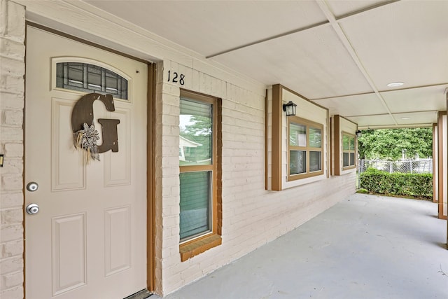 128 Legend Ln, Livingston, TX 77351 - entrance to property featuring brick siding and covered porch