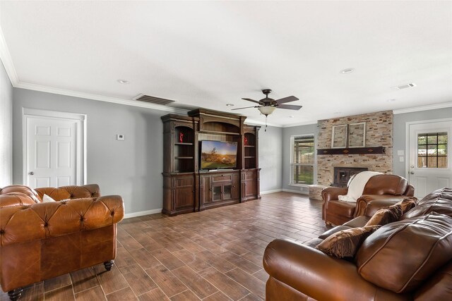 128 Legend Ln, Livingston, TX 77351 - living area featuring visible vents, ornamental molding, a fireplace, baseboards, and a ceiling fan