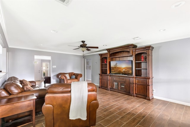128 Legend Ln, Livingston, TX 77351 - living area featuring ceiling fan, visible vents, crown molding, baseboards, and dark wood-type flooring