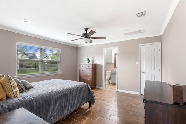 128 Legend Ln, Livingston, TX 77351 - bedroom featuring visible vents, ornamental molding, baseboards, and wood tiled floor
