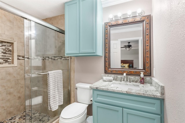 128 Legend Ln, Livingston, TX 77351 - bathroom featuring vanity, ceiling fan, a stall shower, and toilet