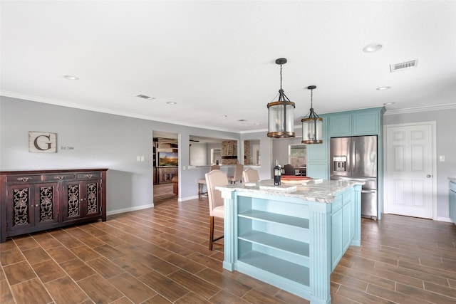 128 Legend Ln, Livingston, TX 77351 - kitchen featuring visible vents, open shelves, ornamental molding, a kitchen bar, and stainless steel fridge with ice dispenser