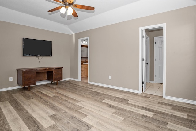 unfurnished living room featuring light wood-style floors, ceiling fan, and baseboards