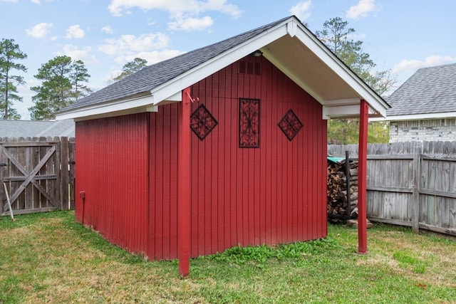 view of shed with fence