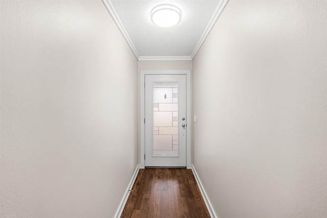 entryway with baseboards, crown molding, and wood finished floors