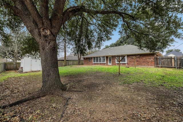 view of yard with a fenced backyard