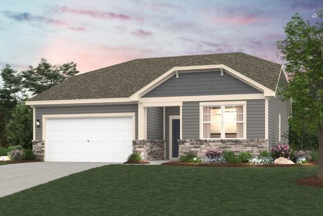 view of front facade featuring driveway, stone siding, an attached garage, and a yard