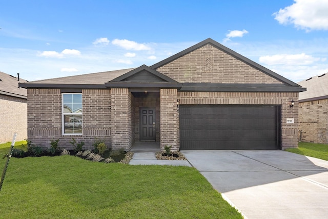 view of front of home featuring a garage, a front lawn, brick siding, and driveway