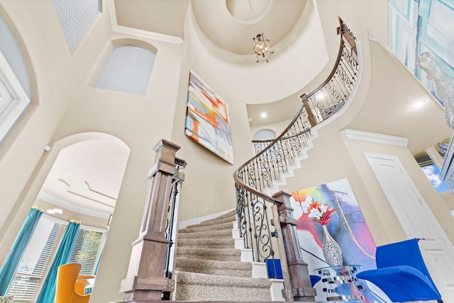 staircase with a high ceiling