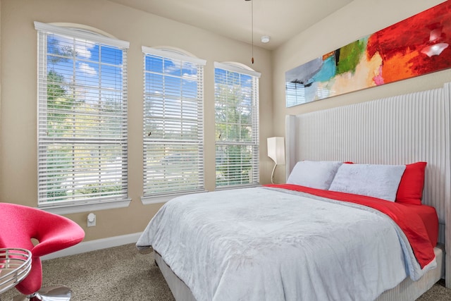 bedroom with carpet and baseboards