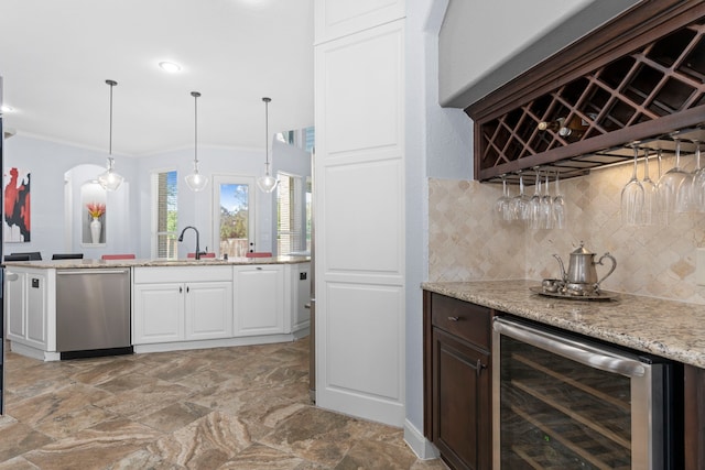 bar with wine cooler, decorative backsplash, dishwasher, a dry bar, and crown molding