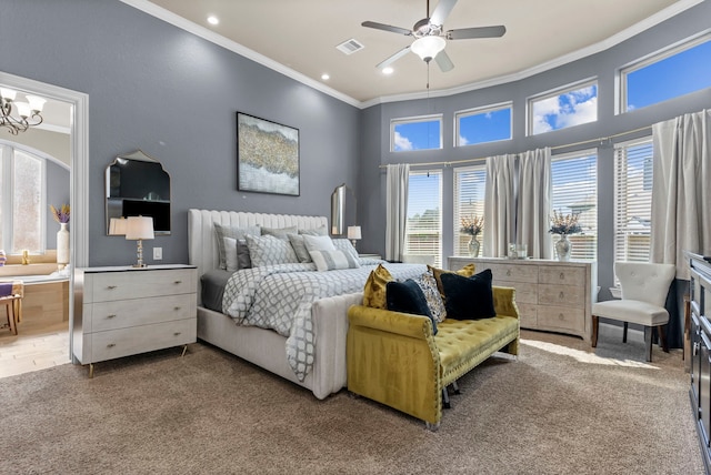 bedroom featuring ensuite bathroom, recessed lighting, visible vents, carpet, and crown molding