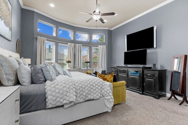 bedroom featuring ornamental molding, a ceiling fan, and light colored carpet