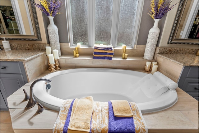 bathroom with vanity and a bathing tub