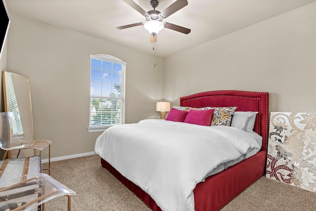 bedroom featuring ceiling fan, carpet flooring, and baseboards