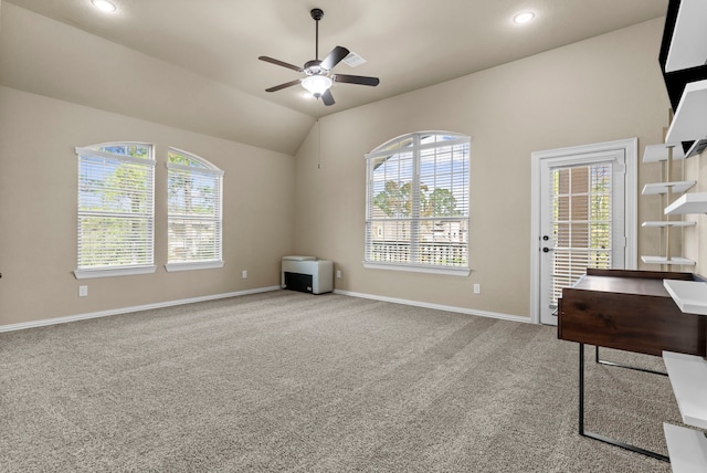 interior space with baseboards, a ceiling fan, lofted ceiling, carpet floors, and recessed lighting