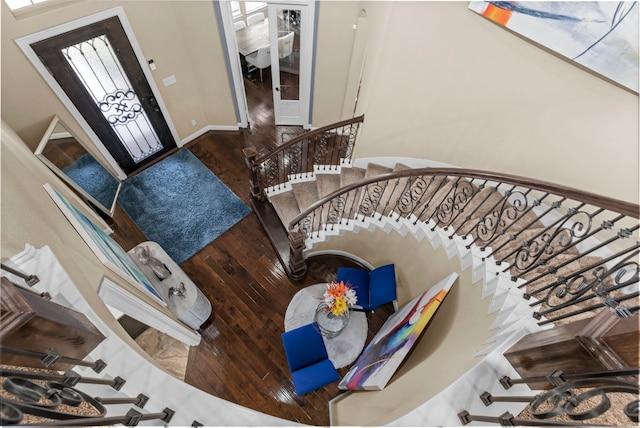 foyer entrance with stairway and wood finished floors