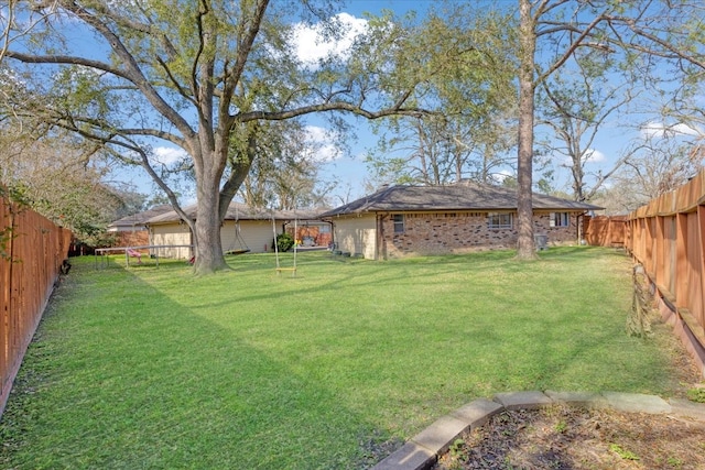 view of yard featuring a fenced backyard