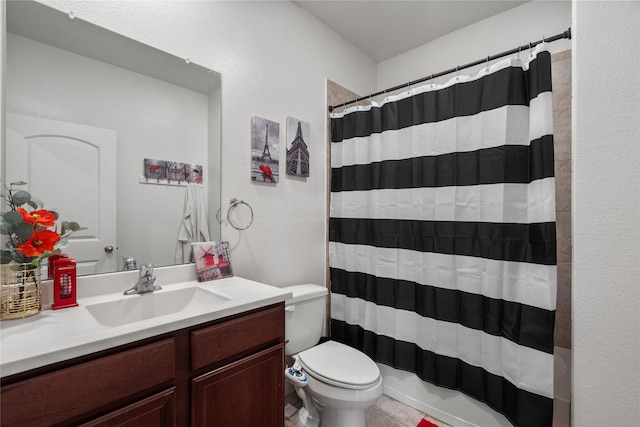 bathroom featuring toilet, shower / tub combo, and vanity