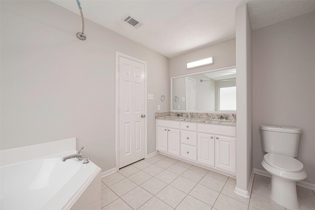 full bathroom featuring toilet, a sink, a bath, tile patterned floors, and double vanity