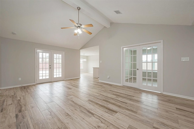 unfurnished living room with light wood-type flooring, beam ceiling, and french doors