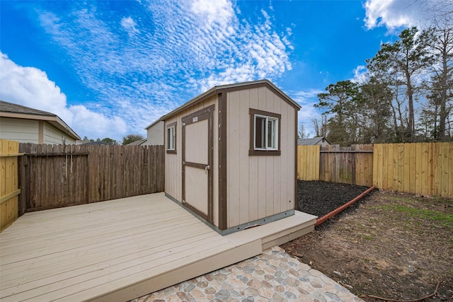 view of shed featuring a fenced backyard