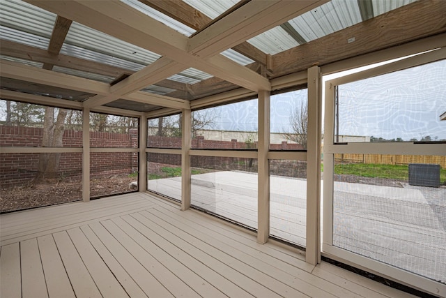 wooden terrace featuring a fenced backyard