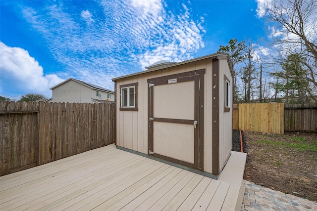 view of shed with a fenced backyard