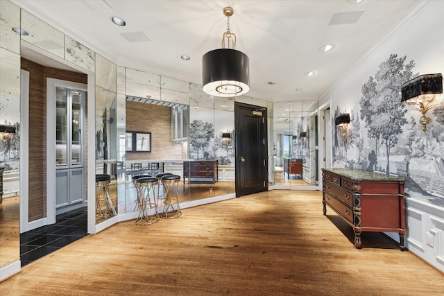 interior space with recessed lighting, crown molding, and wood finished floors