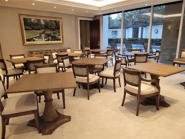 dining area featuring a wall of windows and recessed lighting