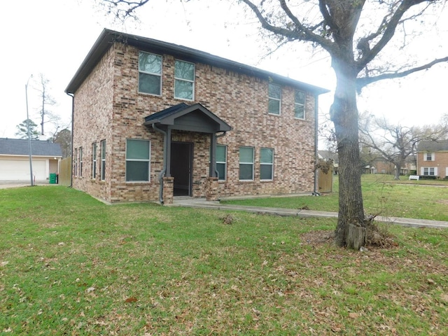 view of front of house with a garage, a front lawn, and brick siding