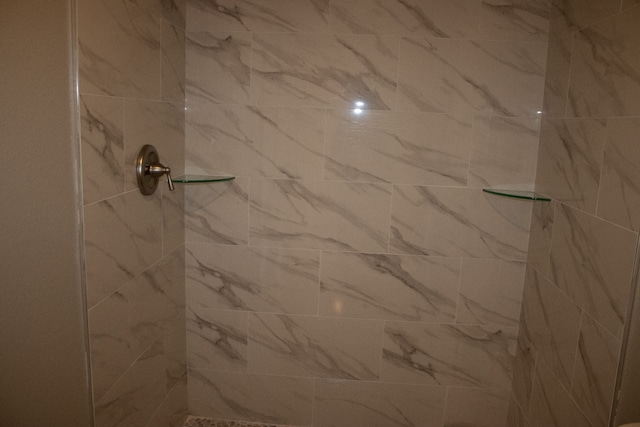 room details with a tile shower