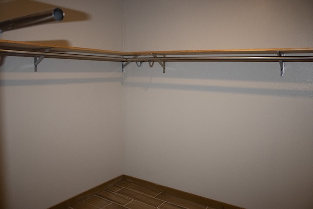 spacious closet featuring wood finish floors