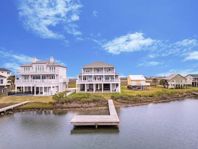 dock area featuring a yard and a water view