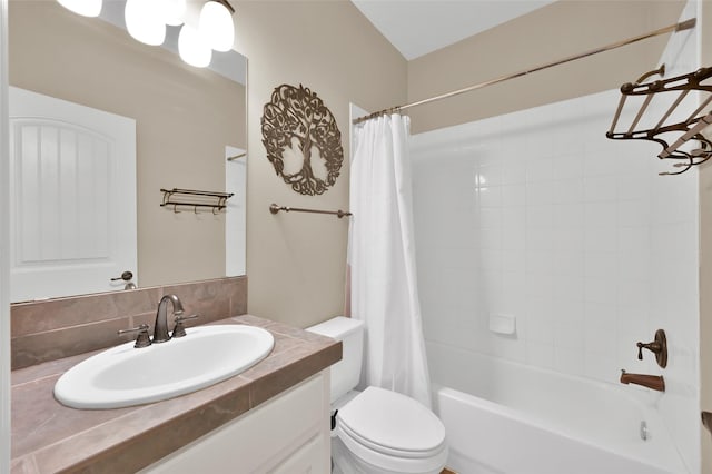 full bath featuring toilet, shower / bathtub combination with curtain, and vanity