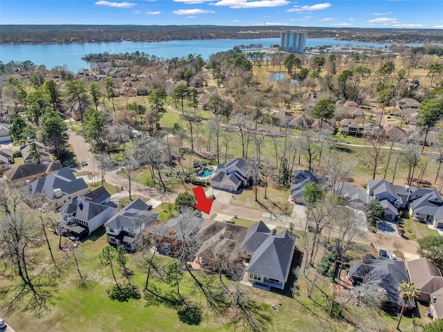 birds eye view of property featuring a water view and a residential view