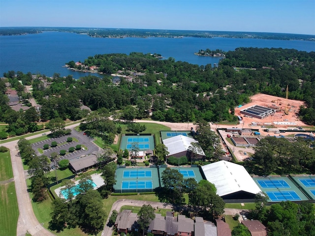 aerial view with a water view and a view of trees